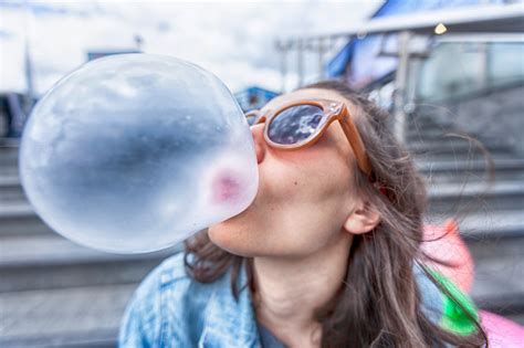 Woman Portrait Blowing A Bubble Chewing Gum Stock Photo Download