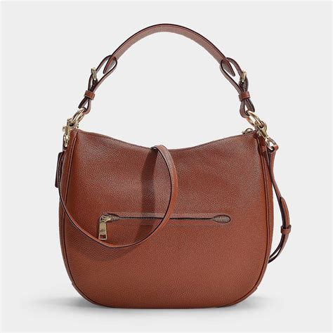 Coach Polished Pebble Leather Sutton Hobo Bag In Brown Calfskin Lyst