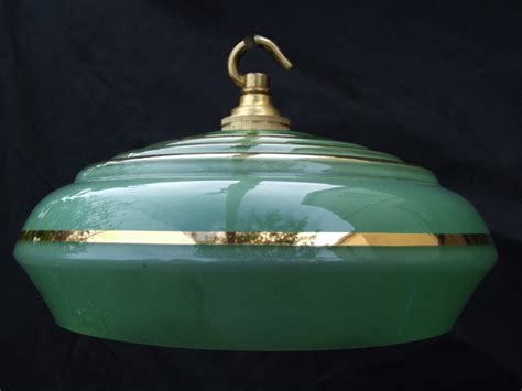 An art deco ceiling light, the flared shade with alternating jewelled and amber panels surmounted by green panels. Art Deco Green Ceiling Light