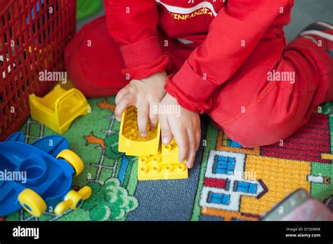 Hands Of A Child Playing With Building Blocks Stock Photo Alamy
