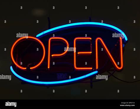 Neon Open Sign In Store Window Glowing Blue Orange Mostly Black