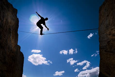 Concept Of Risk Taking Man Balancing On The Rope Stock Photo Download