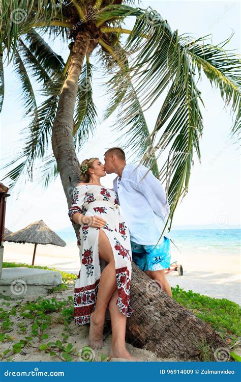 Happy Young Couple Kissing On The Beach Stock Image Image Of Looking