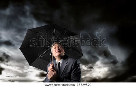 Senior Businessman Umbrella Under Stormy Sky Stock Photo Edit Now