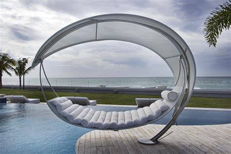 Luxurious Modern Hammock Chair With Connecting Cover Over Swimming Pool