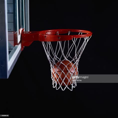 Basketball In Hoop High Res Stock Photo Getty Images