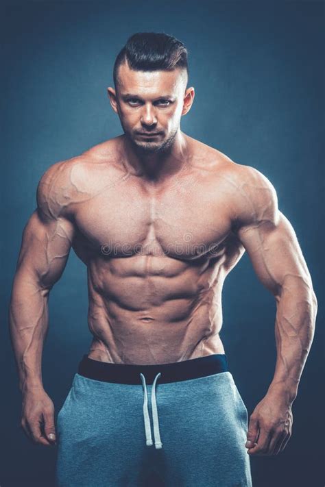Strong Athletic Man Fitness Model Torso Showing Six Pack Abs Is Stock