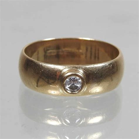 Lot 5 A 9 Carat Gold And Diamond Set Ring