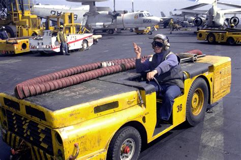 A Sailor Drives An Md 3a Tow Tractor Across The Nuclear Powered