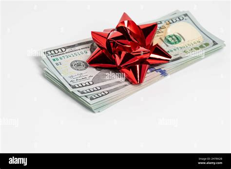 Cash Gift Of 100 Dollar Bills With Red Bow Gift Tax Charitable