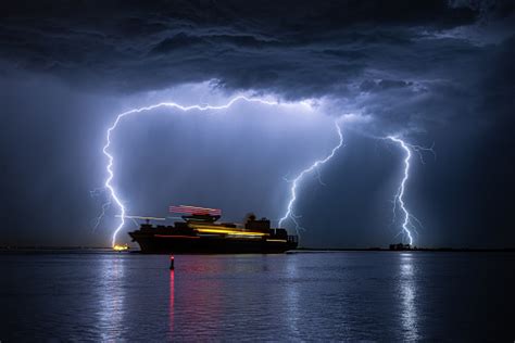 Sailing Ship During A Severe Lightning Storm Stock Photo Download