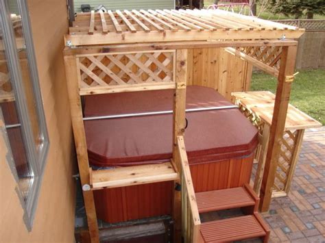 Stay protected from the hot summer sun with this polished pergola and stay warm in winter with this. # hottub! | Hot tub landscaping, Hot tub patio, Hot tubs cheap