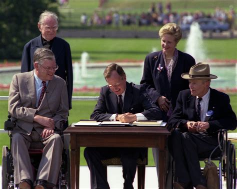 President George H W Bush Signs The Americans With Disabilities Act