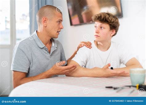 Dad And Teenager Son Having Conversation Stock Photo Image Of Adult