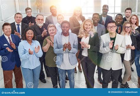 Group Of Diverse Corporate Employees Applauding Together Stock Photo