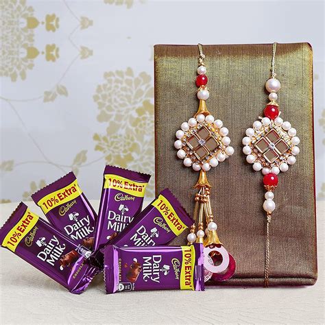 TIED RIBBONS Rakhi For Brother And Bhabhi With Chocolates Gift