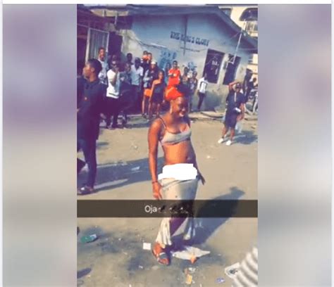 Lady Strips Off In The Middle Of The Road In Mushin Lagos Photos