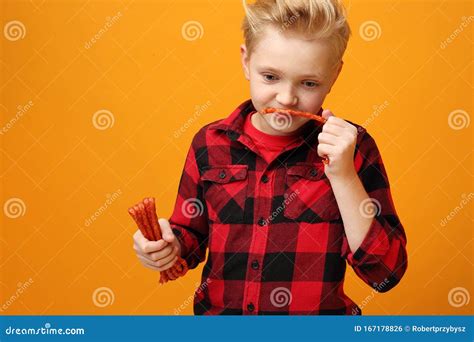 Boy Eats Dry Sausageschild Boy Holds Thin Dry Pork Sausages Stock