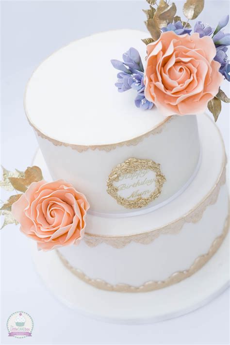Gold And White Cake With Peach Coloured Roses Gold Leaves