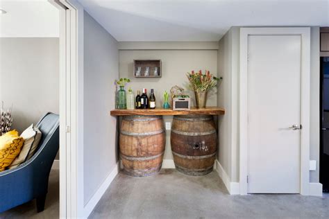 A Wine Bar Made From A Repurposed Wine Barrel Is Nestled Between The