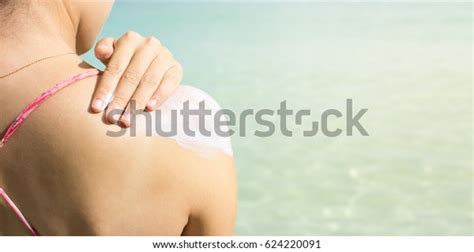 Girl Applying Sun Lotion On Beach Stock Photo Edit Now
