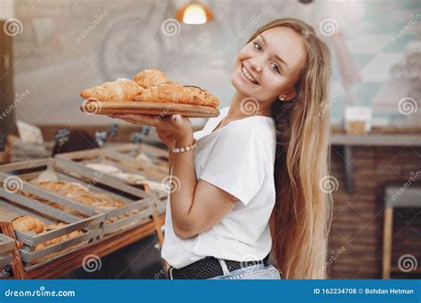 Beautiful Girl Buys Buns At The Bakery Stock Photo Image Of Blonde