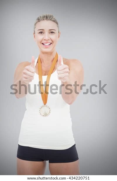 Female Athlete Wearing Medal Showing Thumbs Stock Photo Edit Now