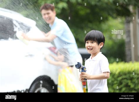 Boy And Girl Helping Father Cleaning Car Stock Photo Alamy