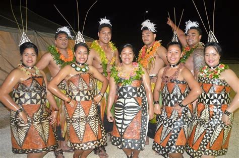 A Group Of Men And Women Dressed Up In Native Clothing Posing For A