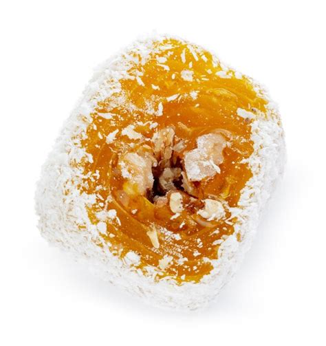 Premium Photo Yellow Turkish Delight With Nuts In Powdered Sugar