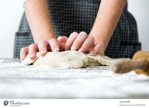 Woman Kneading Bread Dough With Her Hands A Royalty Free Stock Photo