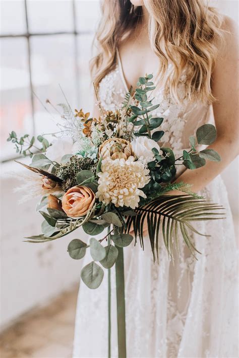 natural freeform bouquet protea bouquet with dried flowers and eucalyptus rustic wedding