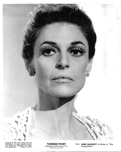 An Old Black And White Photo Of A Woman With Large Lashes On Her Face Looking At The Camera