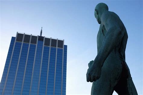 Statue Naked Man Statue In Front High Rise Building Sculpture Image Free Photo