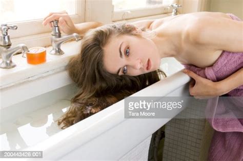 Young Woman Wearing Towel Washing Hair In Sink Photo Getty Images