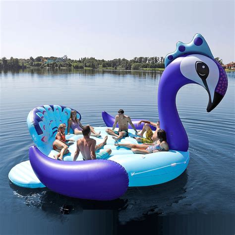 this rainbow unicorn pool float fits six people is where the party s at bóias para piscina