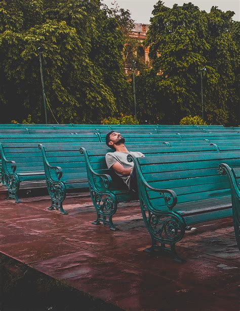 Free Download Hd Wallpaper Man Sitting And Closing Eyes On Teal Bench Adult Bored Fun