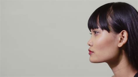 Closeup Profile Of Young Asian Womans Face Stock Footage