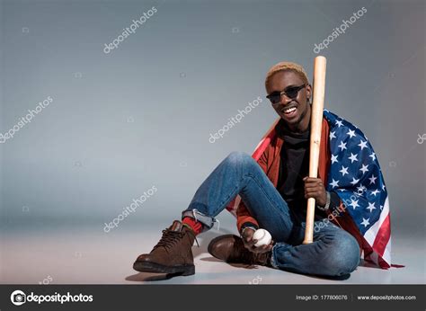 Cheerful Young African American Man Flag Shoulders Holding