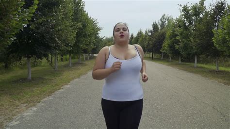 Fat Girl Runs Along The Road Stock Video Footage 0012 Sbv 327480016 Storyblocks