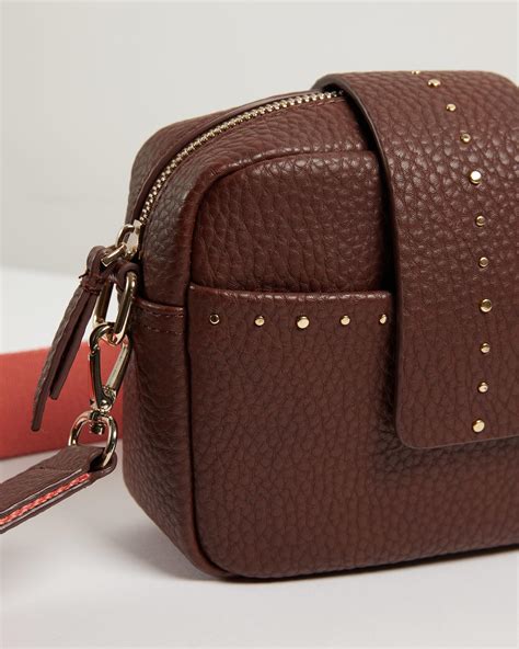 Next day delivery available now. Oliver Bonas Emilia Studded Brown & Pink Crossbody Camera ...