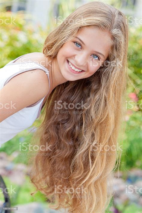 Portrait Of Cheerful Teenage Girl Posing Smiling