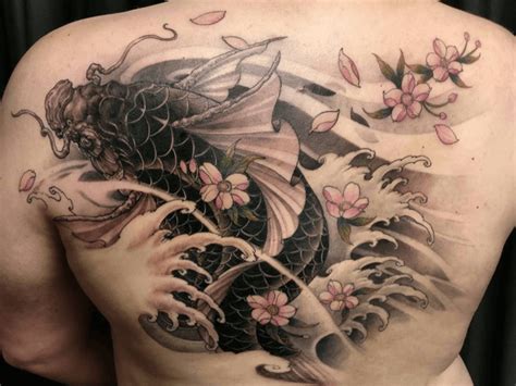 Here is another example of a breathtakingly beautiful koi fish design on a ladies back. Koi Fish Tattoo Designs & Meanings | Asian Tattoos
