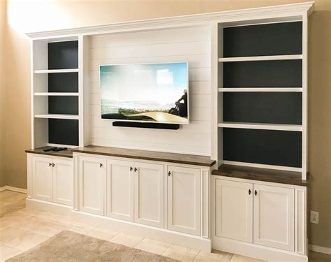 White Entertainment Center With Shiplap Upper And Painted Shelf Backing