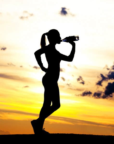 Silhouette Of A Beautiful Woman Running Down The Hill Against Yellow