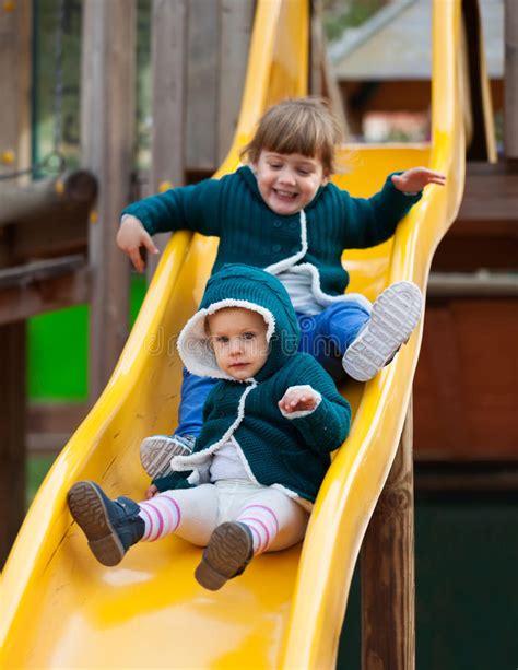 Happy Children On Slide At Playground Stock Photo Image Of Girl