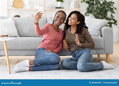 Cute Black Girlfriends Taking Selfie Together On Phone Stock Image Image Of Floor House