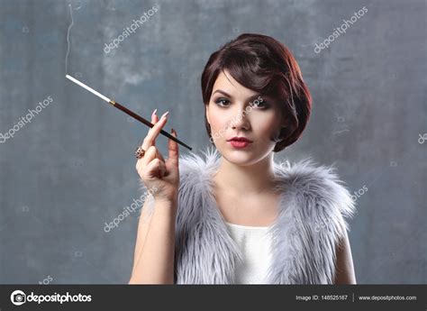 Woman Smoking With Cigarette Holder Stock Photo By ©belchonock 148525167