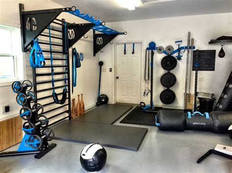 The oficial gyms have an even better set up. MoveStrong garage set up! DynaBells, pullup bracket system ...