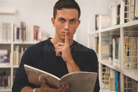 Handsome Young Man Reading At The Library Stock Photo Image Of
